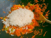 Beaten rice with carrots, onions and turmeric