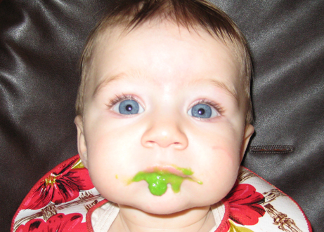 Lila enjoying organic pea mush!