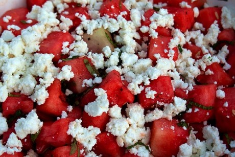 Watermelon and feta cheese salad with mint garnish.