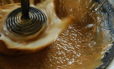 After reducing and caramelising the sap, the sugar is whipped with a spring whisk.