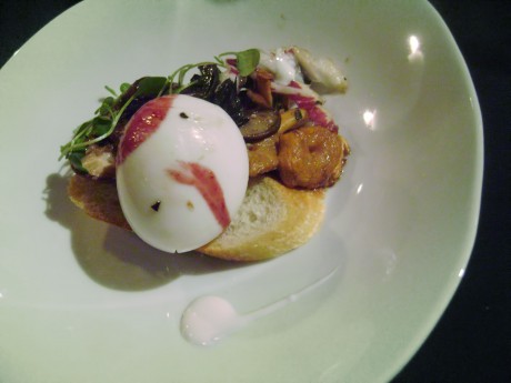 7 Poached Hen's egg with forest mushrooms and red wine reduction served on a crostini
